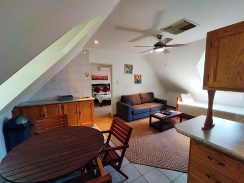One bedroom apartment upstairs, lounge with two single beds